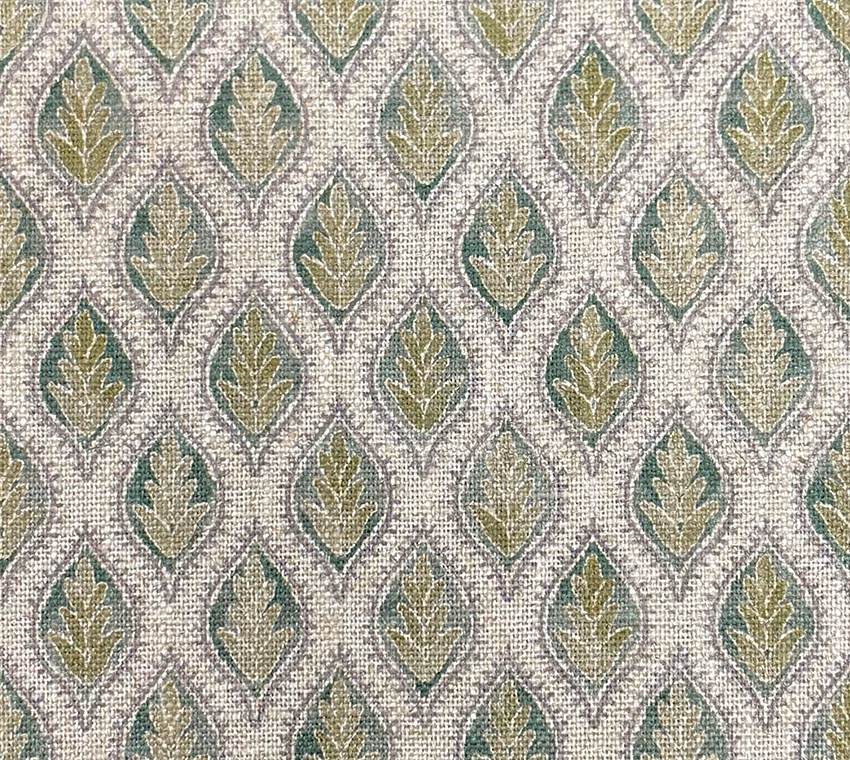 Textured cream fabric with repeating sage, olive and teal leaf motifs