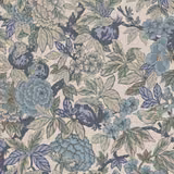 Dense dusty blue and sage floral fabric on a warm cream ground with leafy motifs