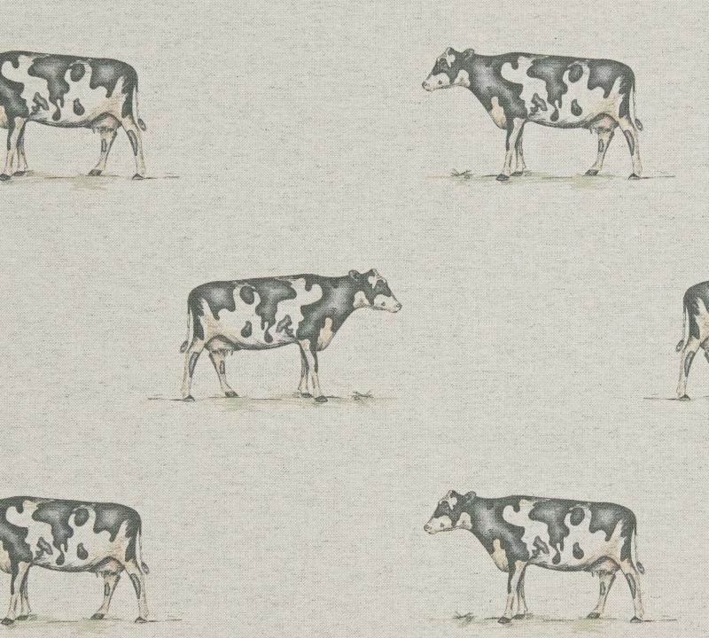 Pale greige woven fabric with repeating charcoal and grey cow motifs