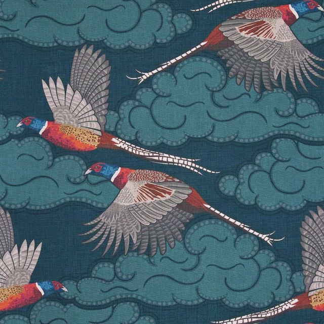 Deep teal fabric with flying birds, pale wings and scrolling cloud motifs