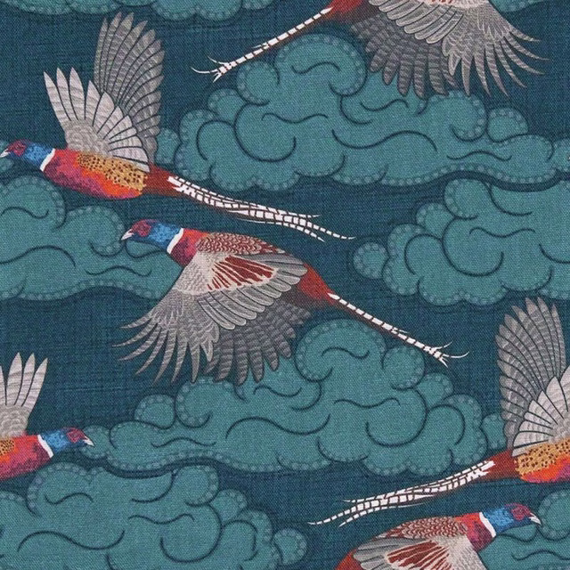 Deep teal fabric with turquoise clouds, grey-winged cranes and red-orange details