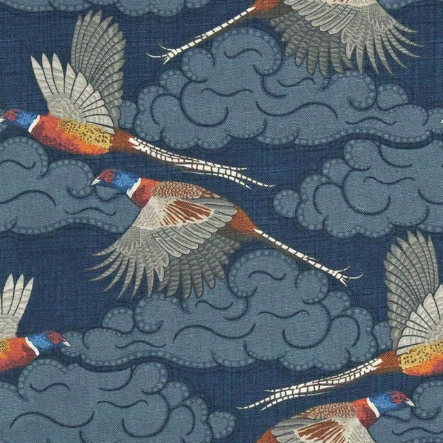 Deep blue woven fabric with flying birds, curling clouds, cream feathers and rust accents