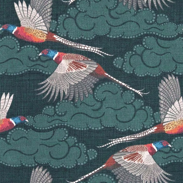 Deep blue-teal fabric with flying red, cream and blue birds among scrolling cloud motifs