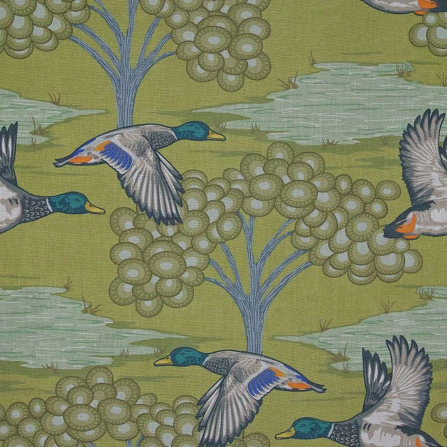 Muted olive fabric with mallards, blue-trunked trees and rippling pale water