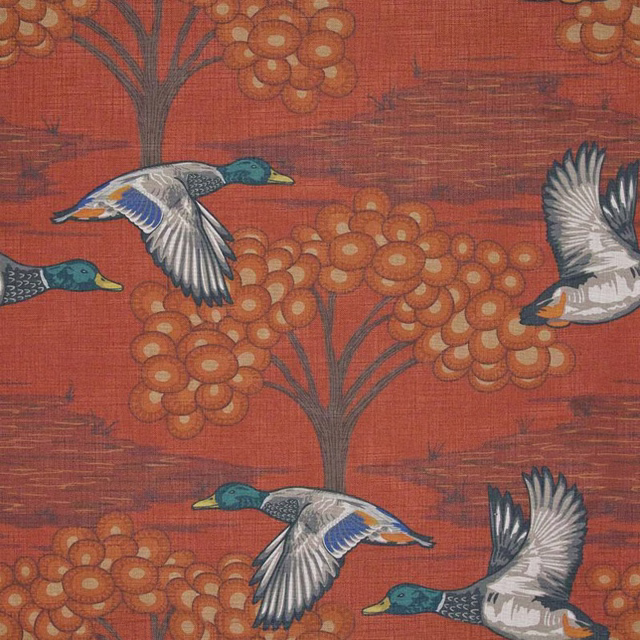 Terracotta textile with teal ducks, orange blossom clusters and crosshatched ground