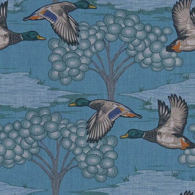 Muted teal-blue fabric with flying mallards and clustered rounded tree motifs