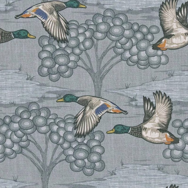 Muted blue-grey fabric with flying mallards and rounded floral clusters