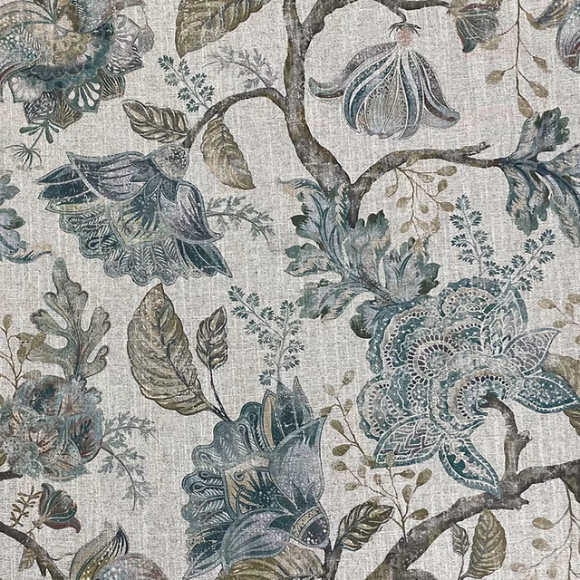 Muted emerald botanical fabric with teal flowers and dark leafy branches on a pale textured ground
