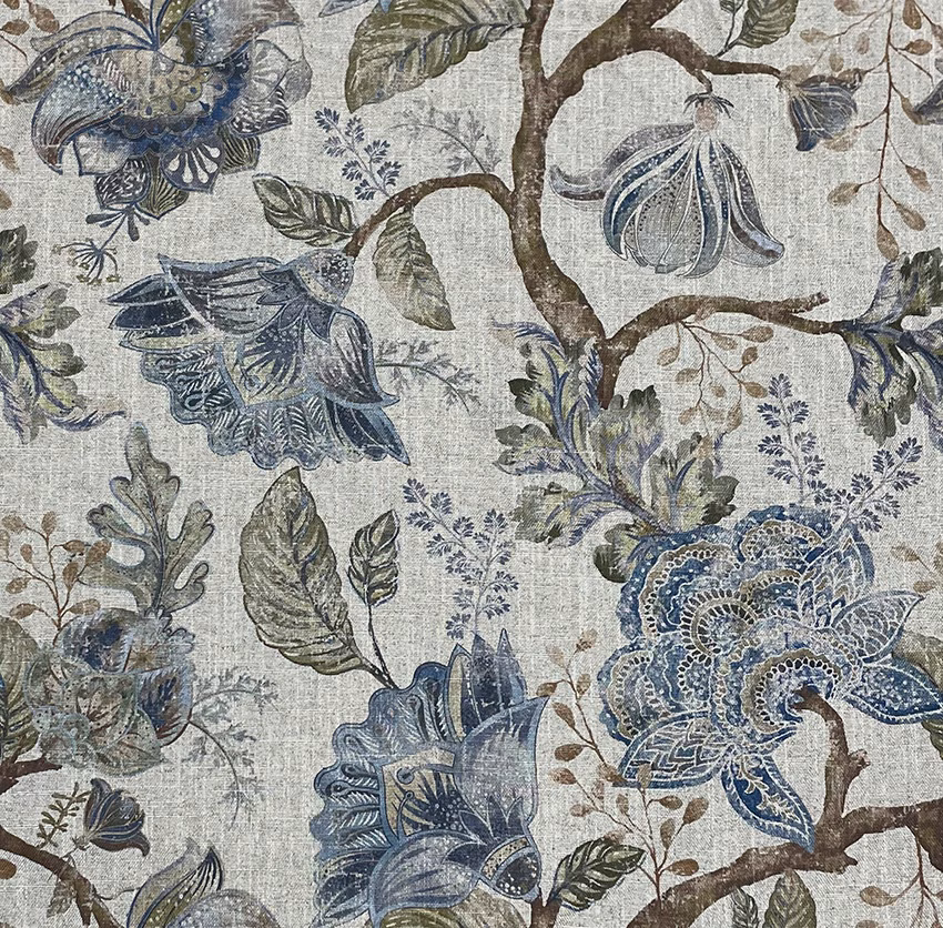 Ink-blue botanical blooms and pods on a grey-beige slub-textured woven fabric