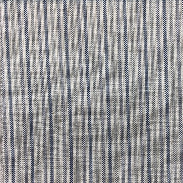 Close-up of muted denim-blue, cream and grey narrow stripes in a textured weave