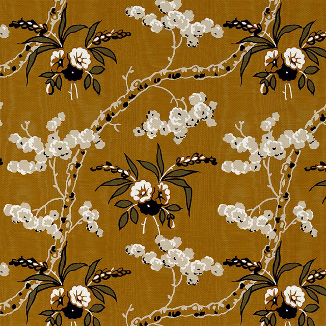 Warm ochre-gold textile with cream blossom branches and dark leafy outlines