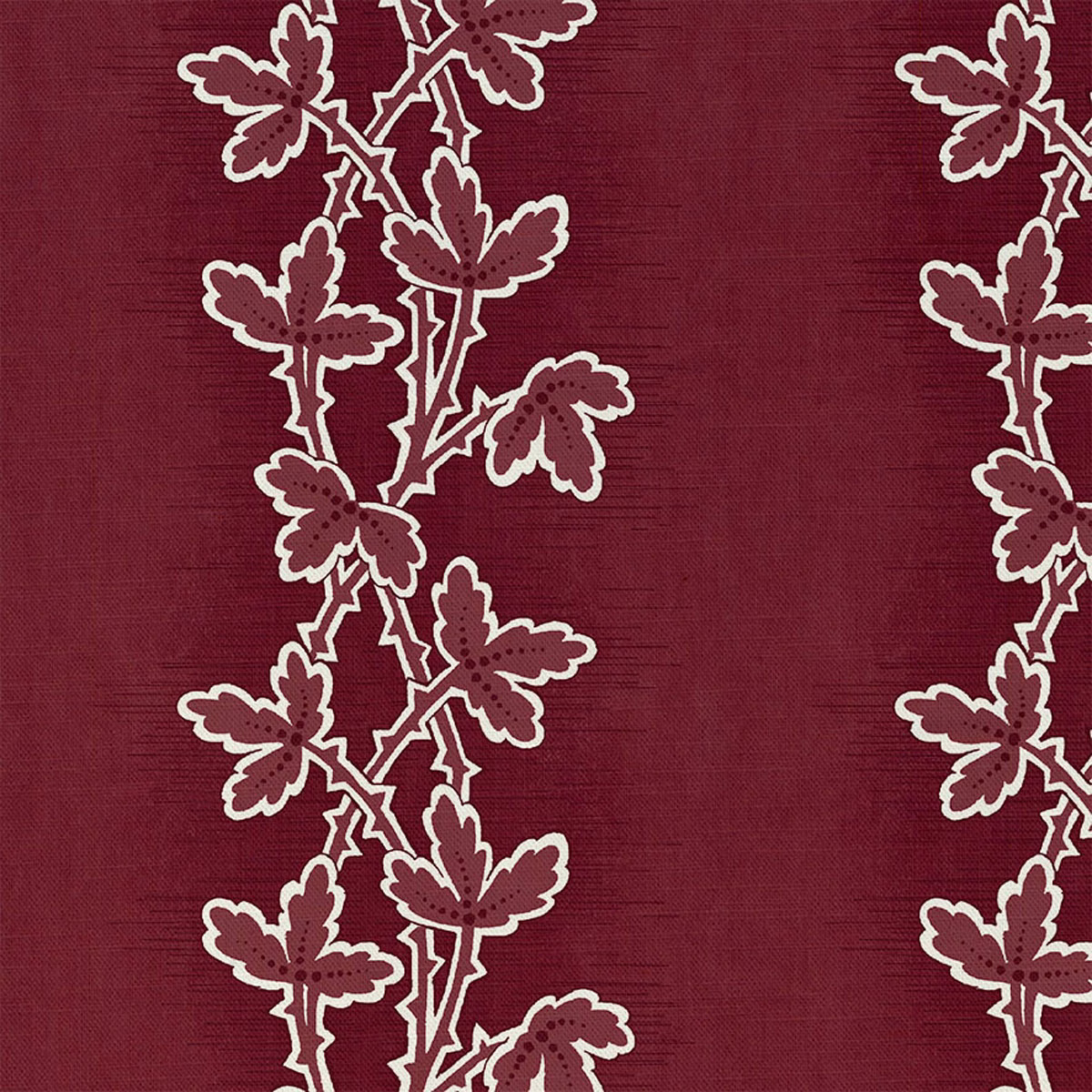 Deep madder-red textile with cream-edged leafy stems on a fine woven ground
