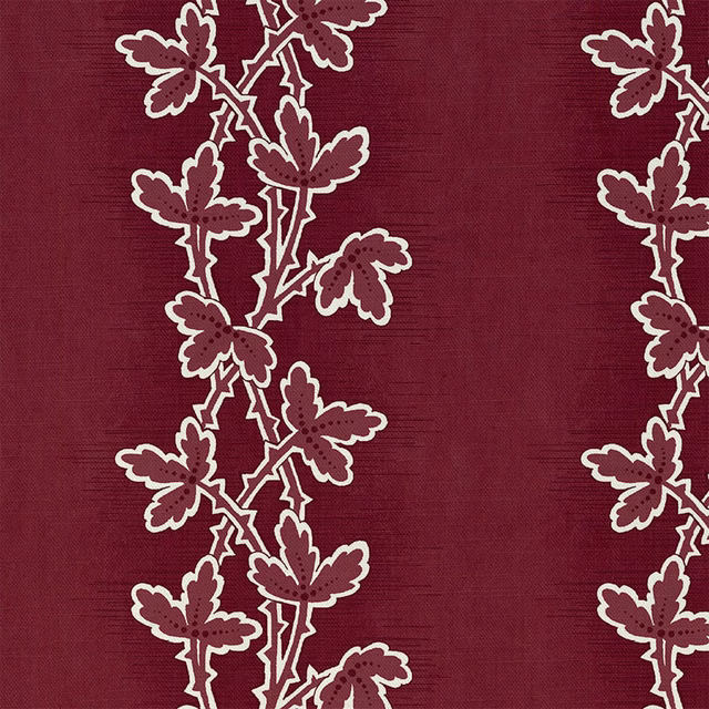 Deep madder-red textile with cream-edged leafy stems on a fine woven ground