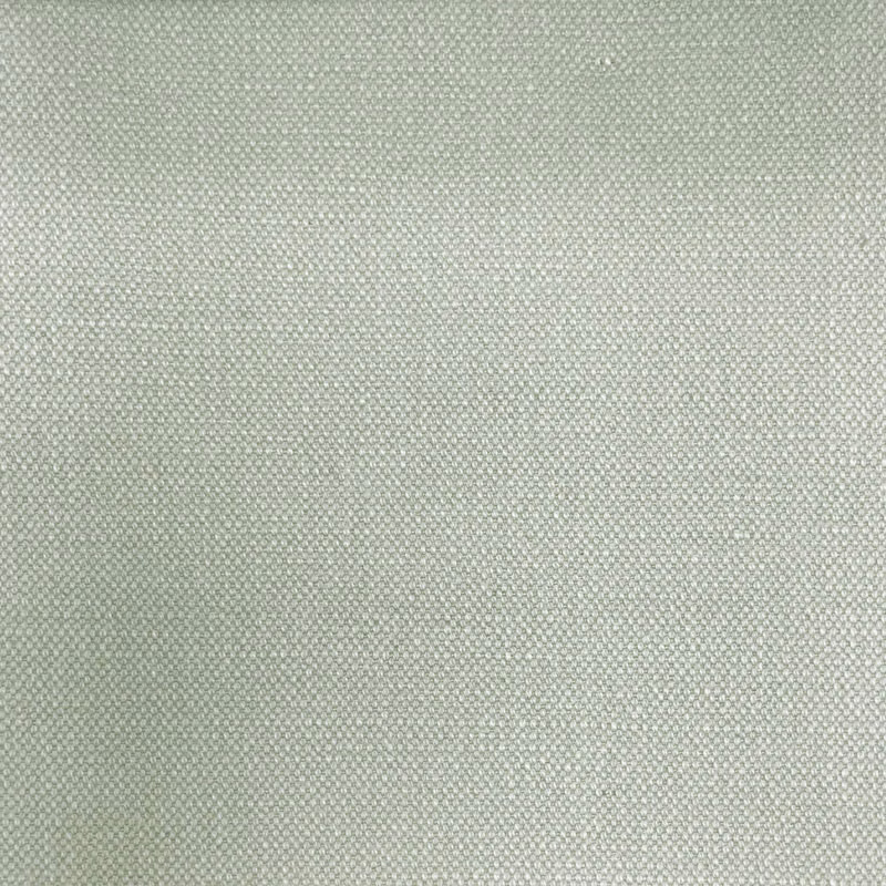 Pale greyed pistachio green fabric with a fine, even woven texture