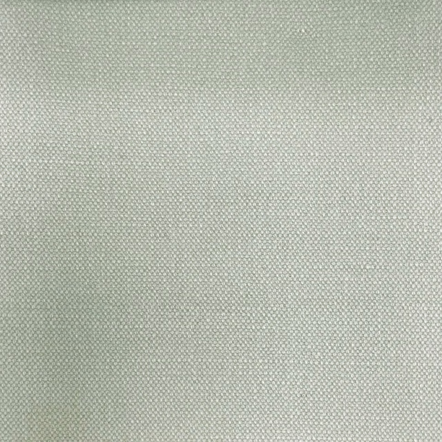 Pale greyed pistachio green fabric with a fine, even woven texture
