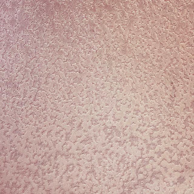Dusty blush pink fabric with softly raised, mottled mineral-like texture
