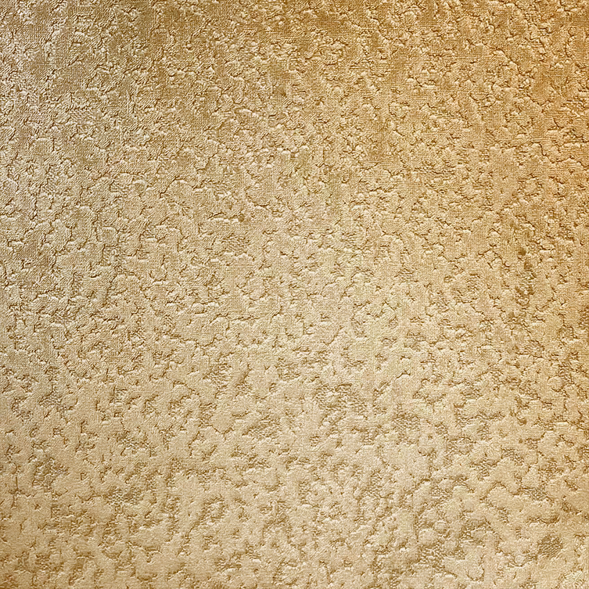Warm bronze-gold fabric with irregular raised mottling and softly shimmering texture