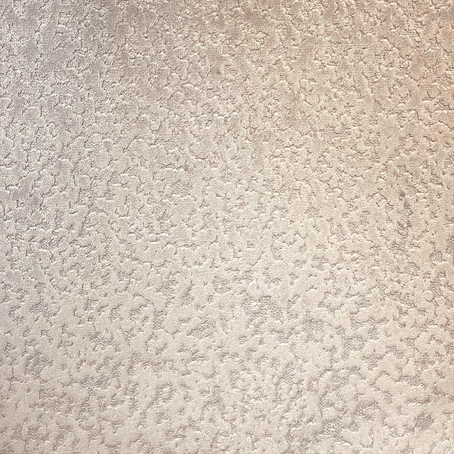 Pale truffle taupe fabric with a raised, softly mottled all-over texture