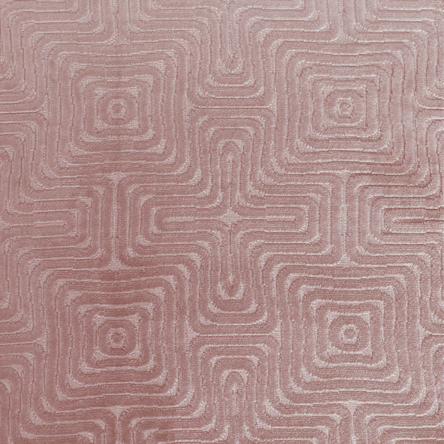 Muted blush-pink textile with raised nested maze lines and softly glinting texture