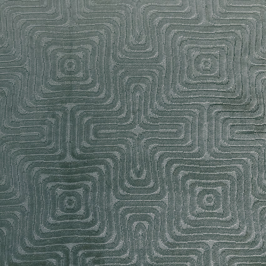 Muted forest-green woven fabric with tonal rounded-square maze pattern and textured surface
