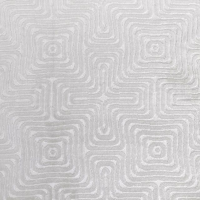 Pale oyster-grey textile with raised interlocking maze lines and soft woven texture