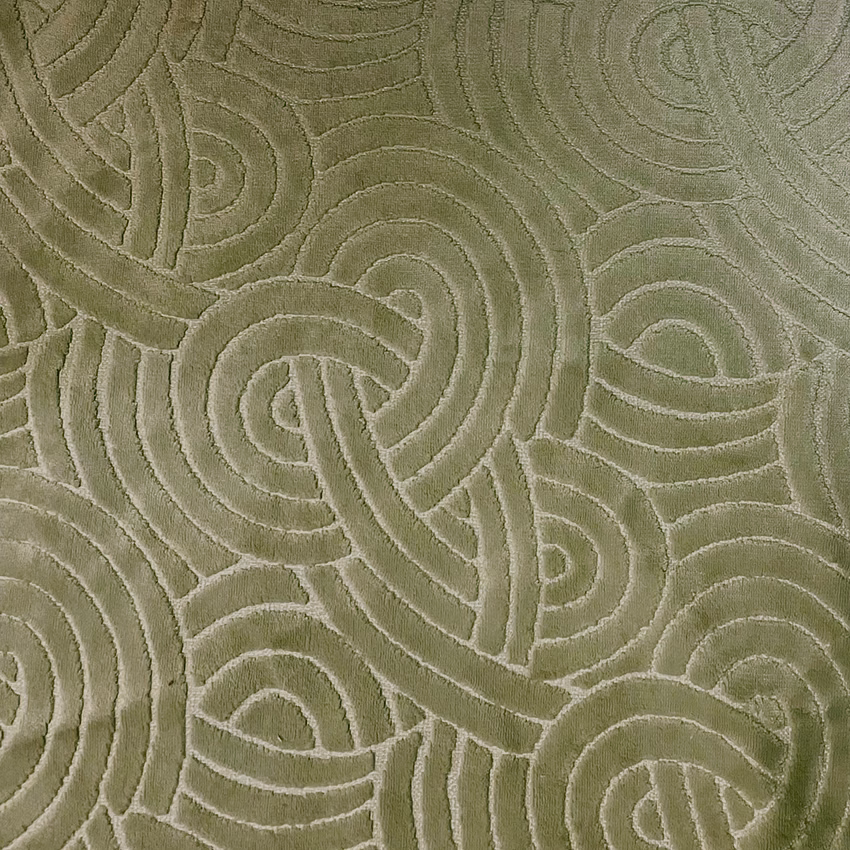 Muted olive-green textile with raised interlocking loops and softly tactile tonal texture