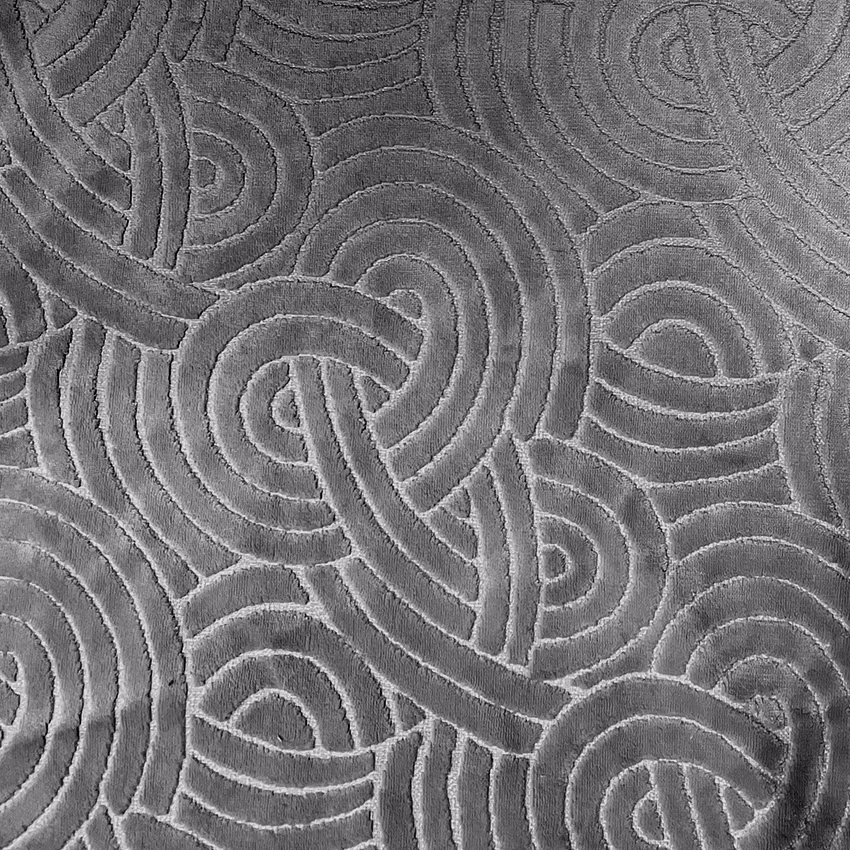 Charcoal-grey fabric with raised interlocking loops and tonal maze-like texture