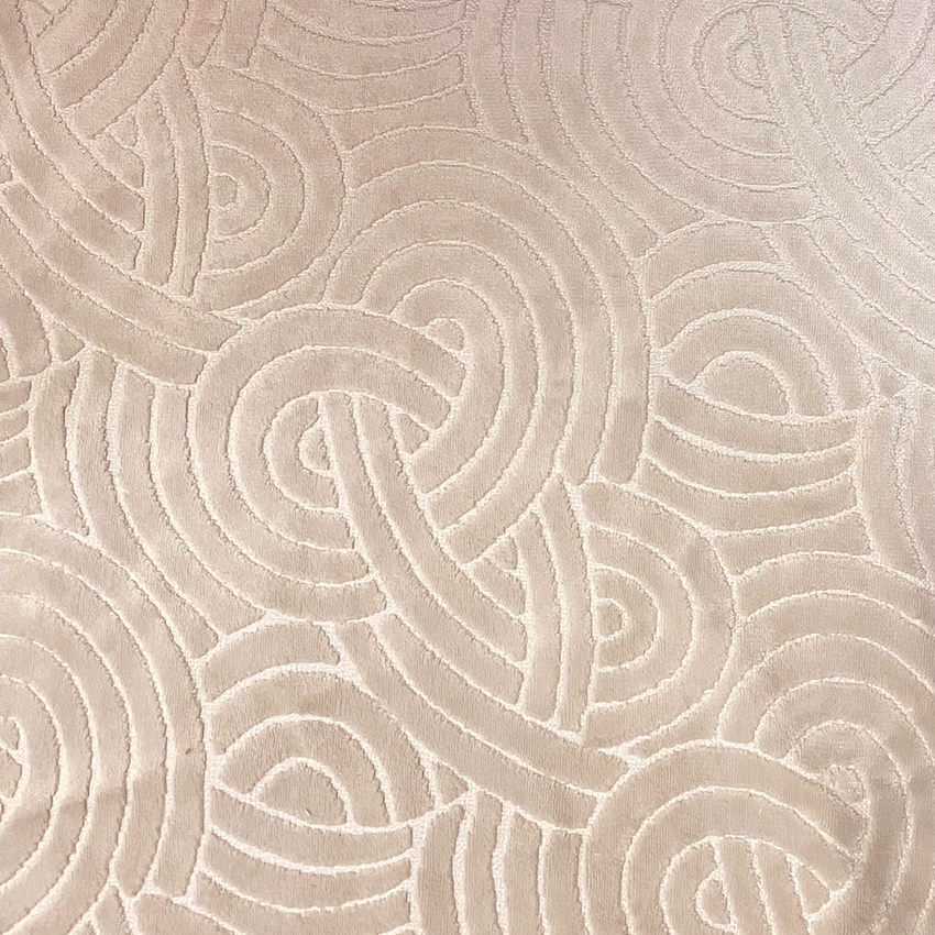 Warm taupe fabric with raised abstract looping lines and a softly plush texture