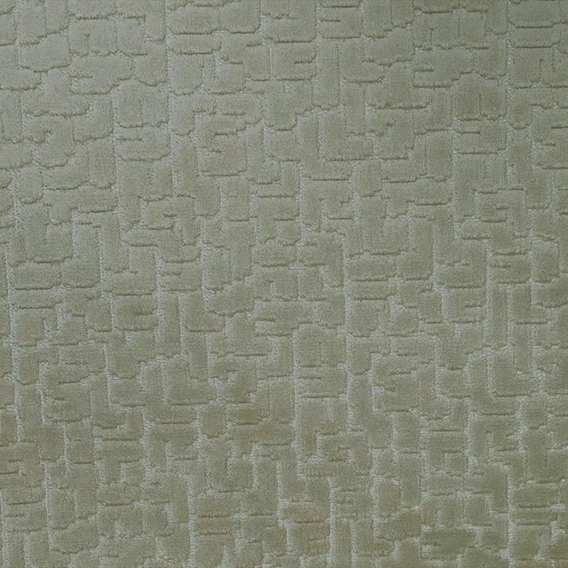 Muted fern-green fabric with a raised, irregular brick-like geometric weave