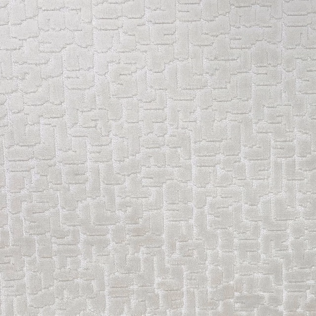 Pale oyster textile with raised irregular rectangular lines and softly shadowed texture