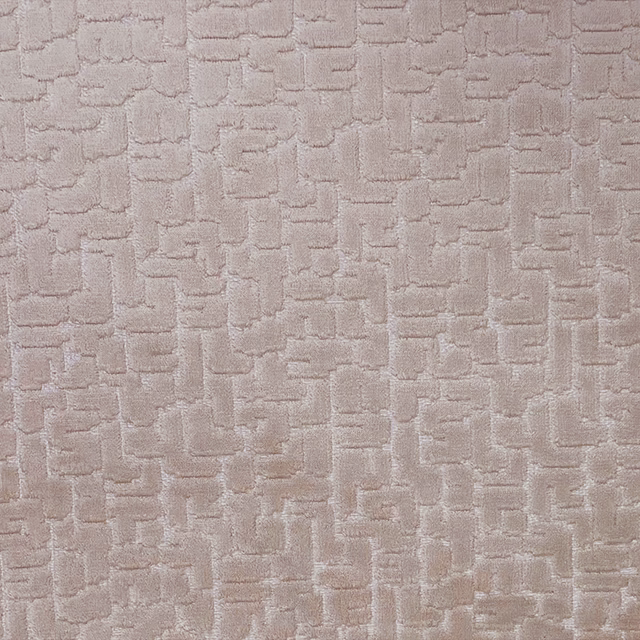 Warm taupe textile with raised interlocking geometric blocks and subtle woven sheen