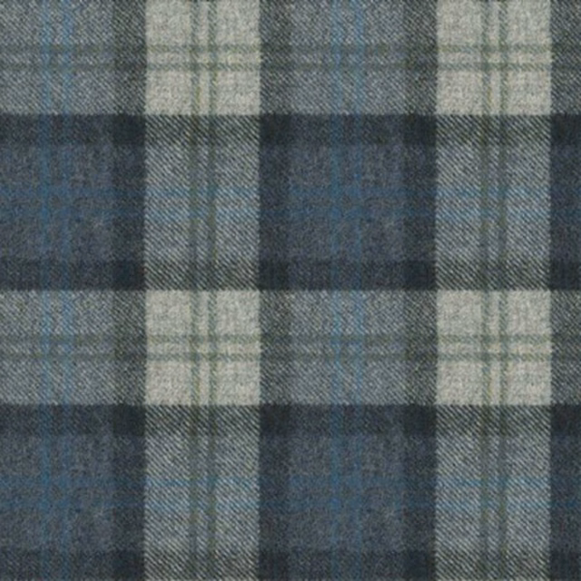 Muted blue-grey plaid with cream and charcoal checks on a softly textured woven surface
