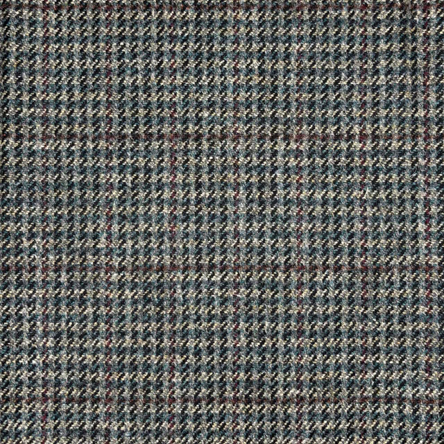 Blue-grey tweed with fine herringbone texture, cream flecks and rust accents