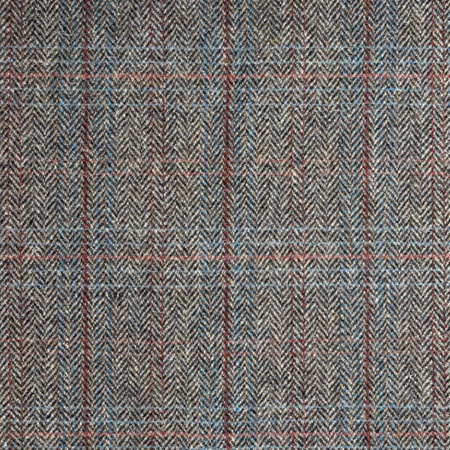 Charcoal grey herringbone tweed with muted blue and coral horizontal flecks