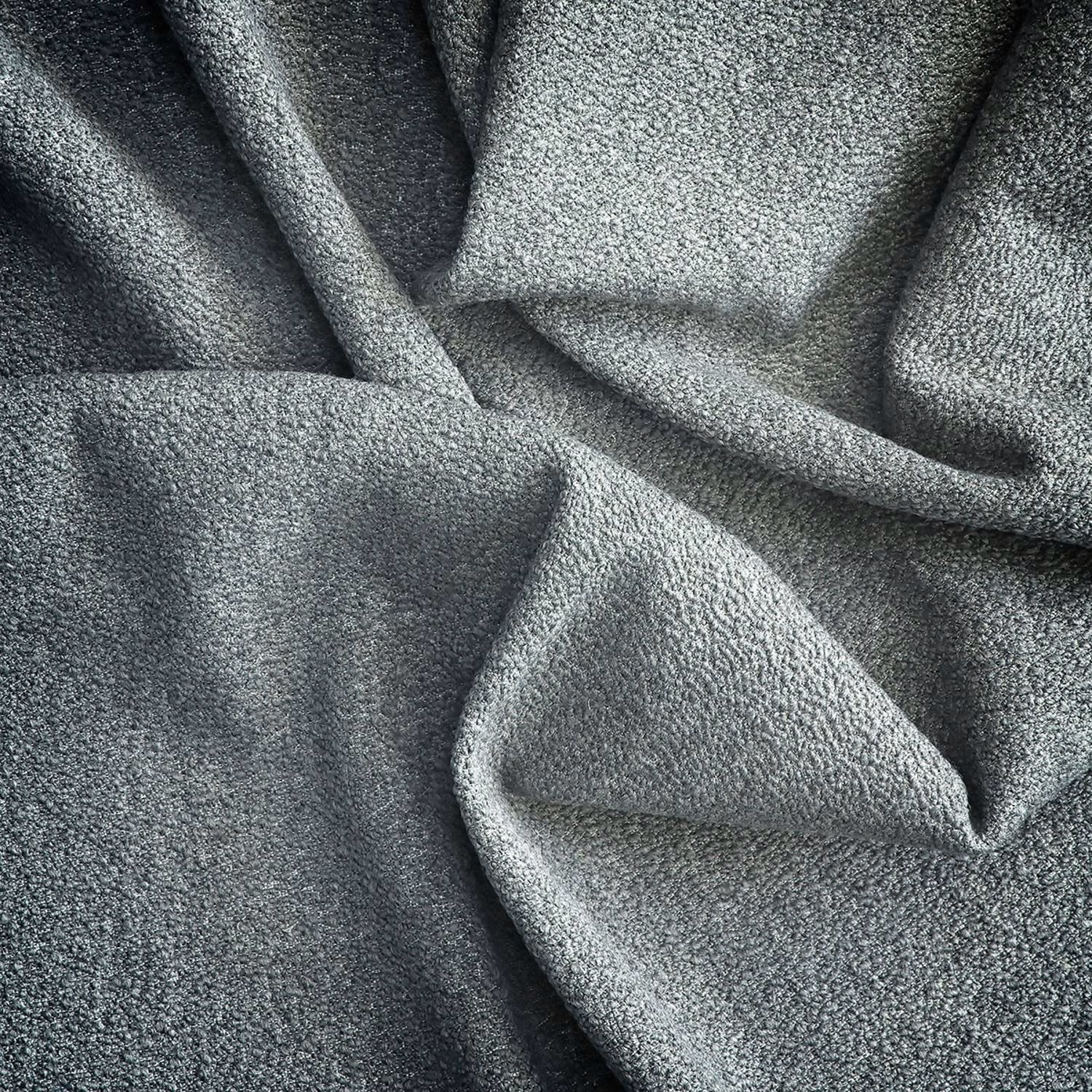 Charcoal-grey fabric with a dense nubby weave gathered into soft folds