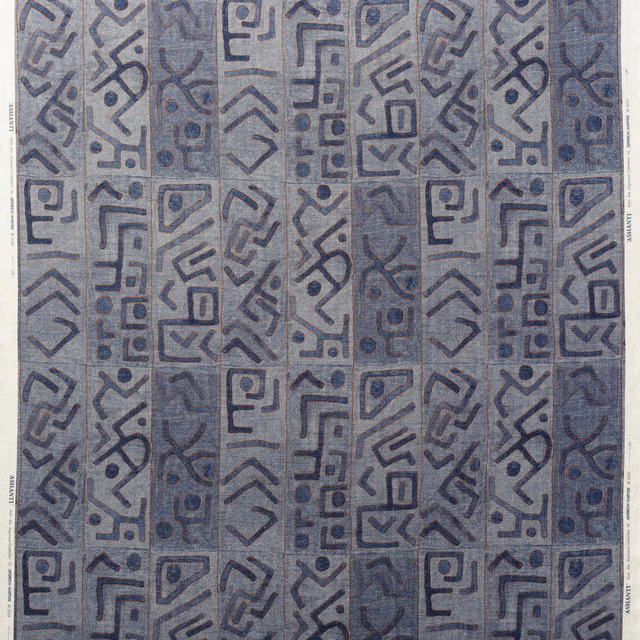 Cool blue-grey woven fabric with dark angular geometric bands and motifs