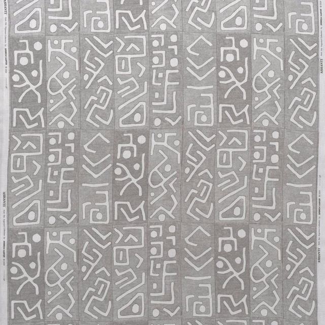 Smoky-grey fabric with repeating ivory abstract geometric symbols and subtle surface texture