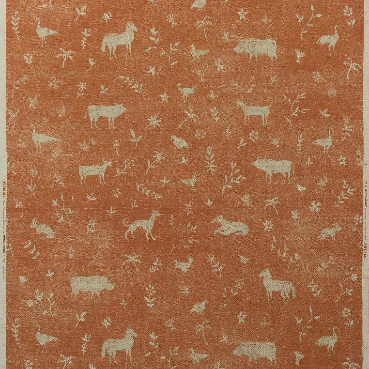 Brick terracotta fabric with pale illustrated animals, stars, flowers and leafy sprigs
