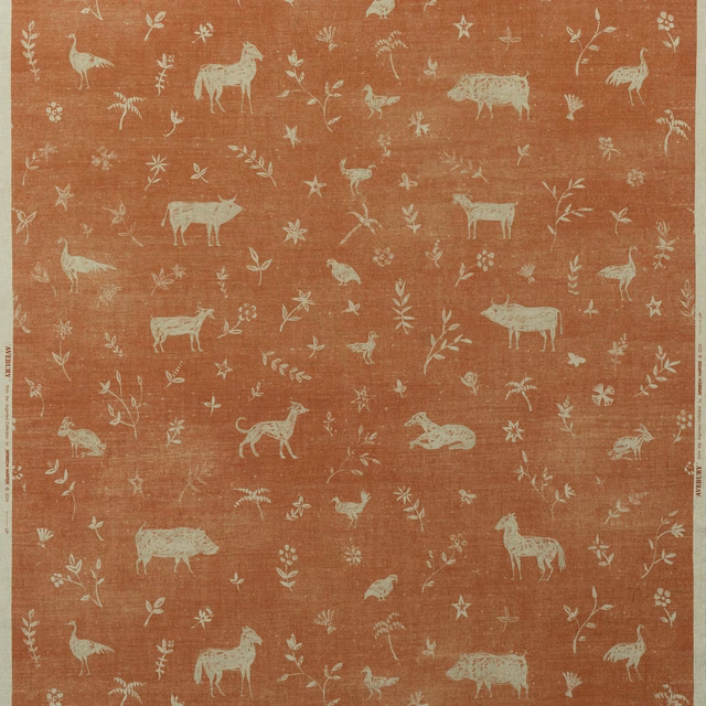 Brick terracotta fabric with pale illustrated animals, stars, flowers and leafy sprigs