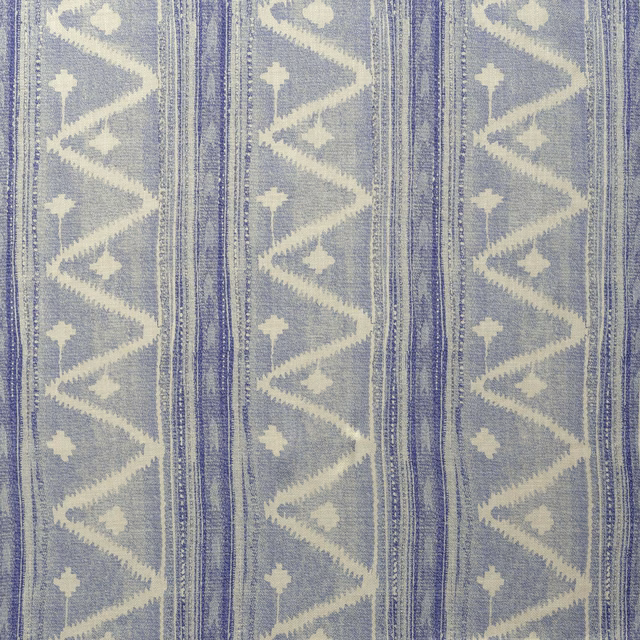 Muted denim-blue woven swatch with vertical stripes, zigzags and ivory cross motifs