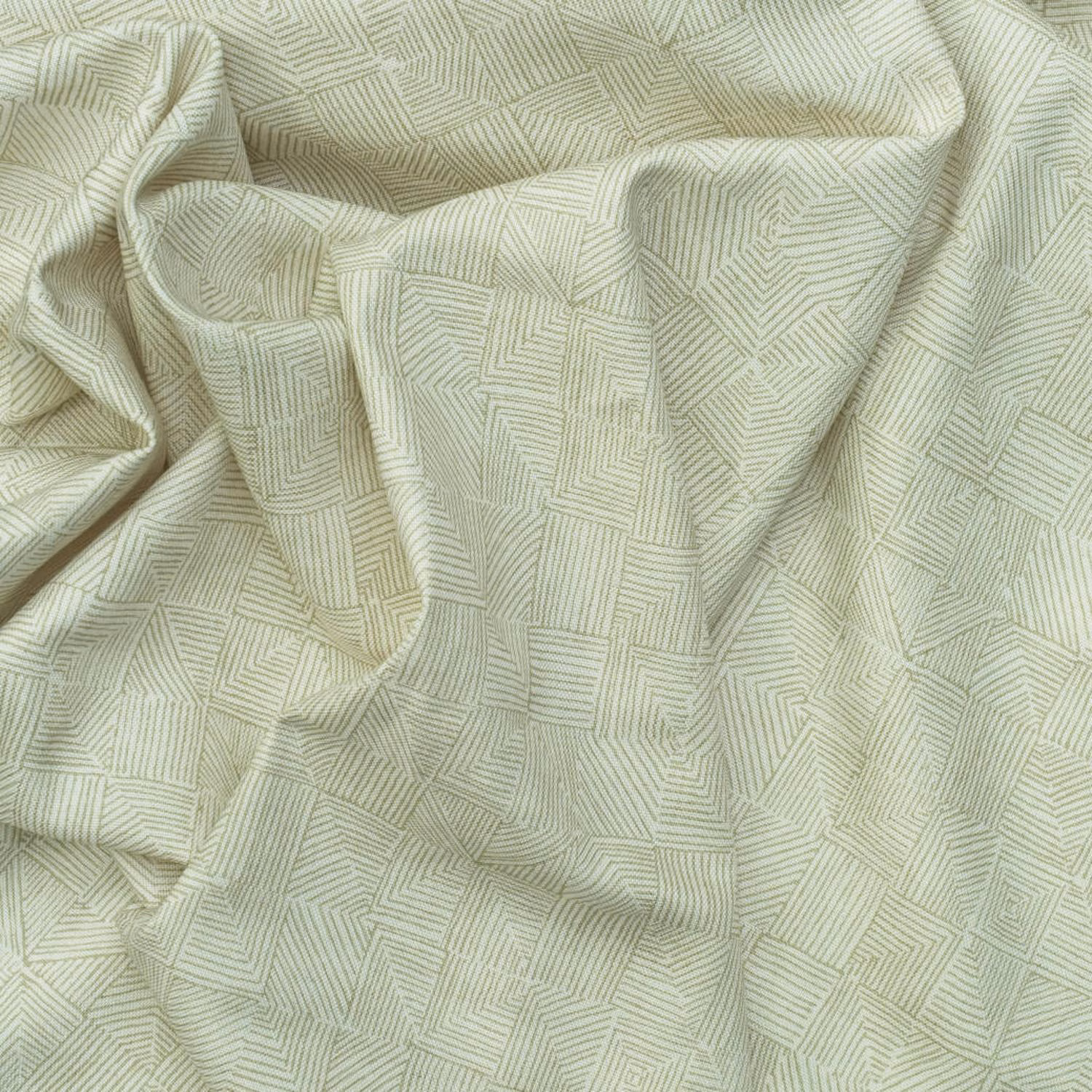 Pale lichen-green fabric with fine angular geometric lines in relaxed folds
