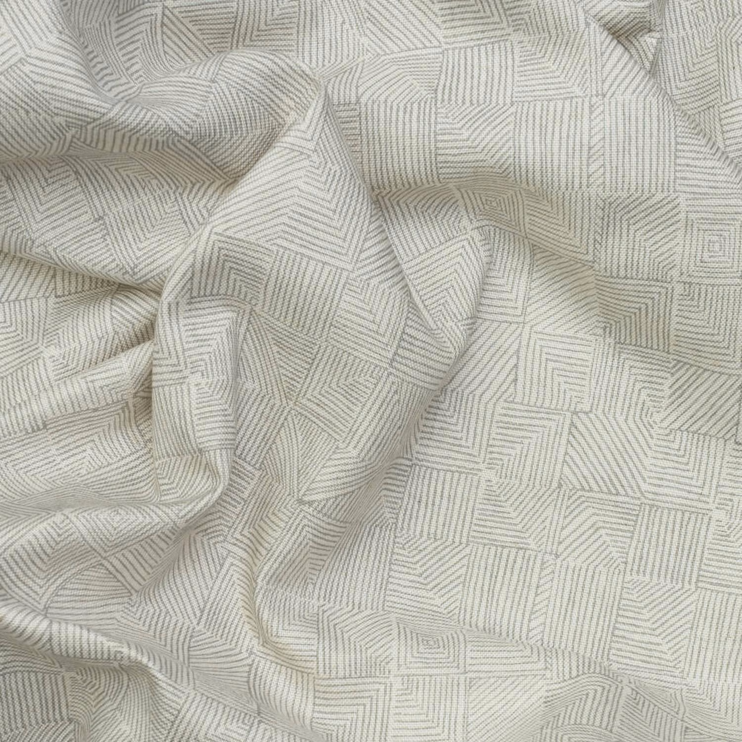 Pale warm-grey fabric with fine nested geometric lines and softly rumpled folds