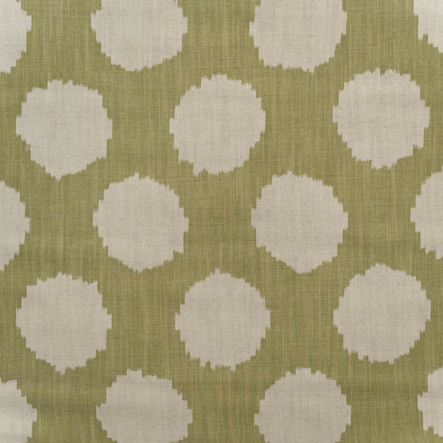 Muted olive-sage cotton print with irregular ivory circular motifs and visible fine weave