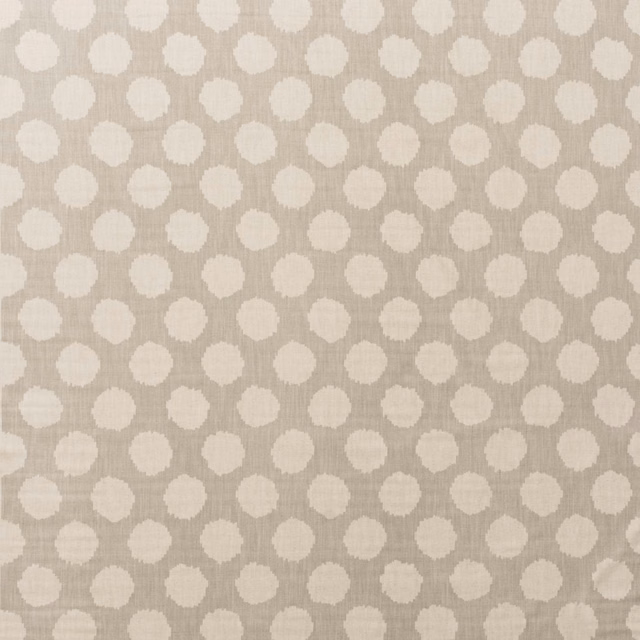 Warm stone cotton ground with off-white irregular beehive motifs and fine vertical grain