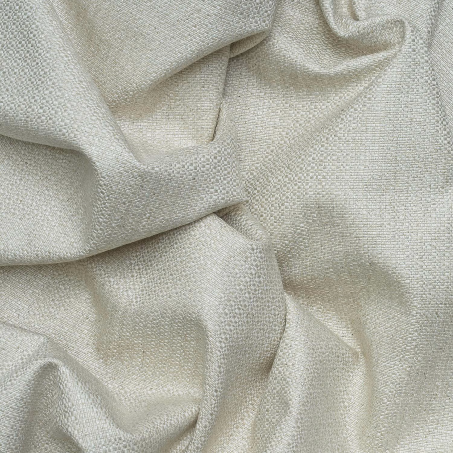Pale greige Birch Stone fabric showing a fine pebbled basket weave in soft folds