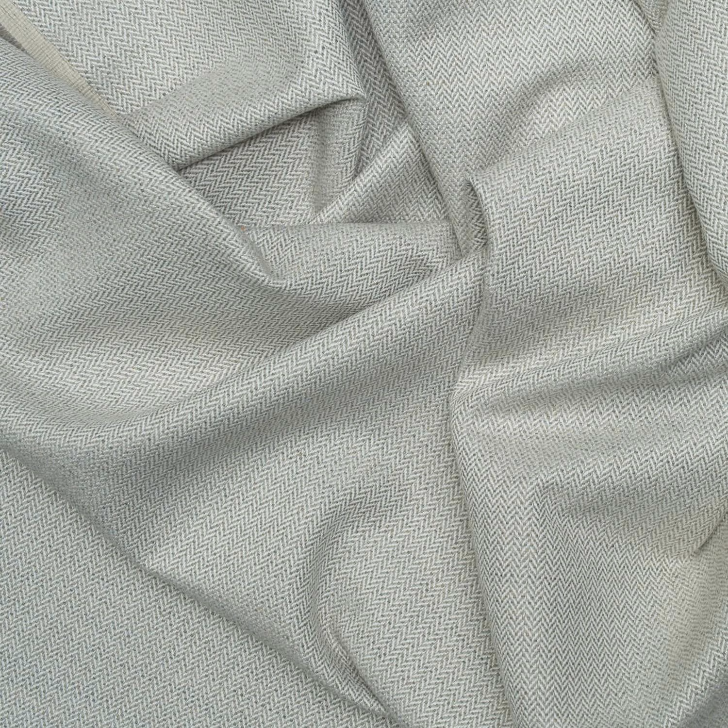 Close-up of cool storm-grey Birds Foot weave in softly folded cloth