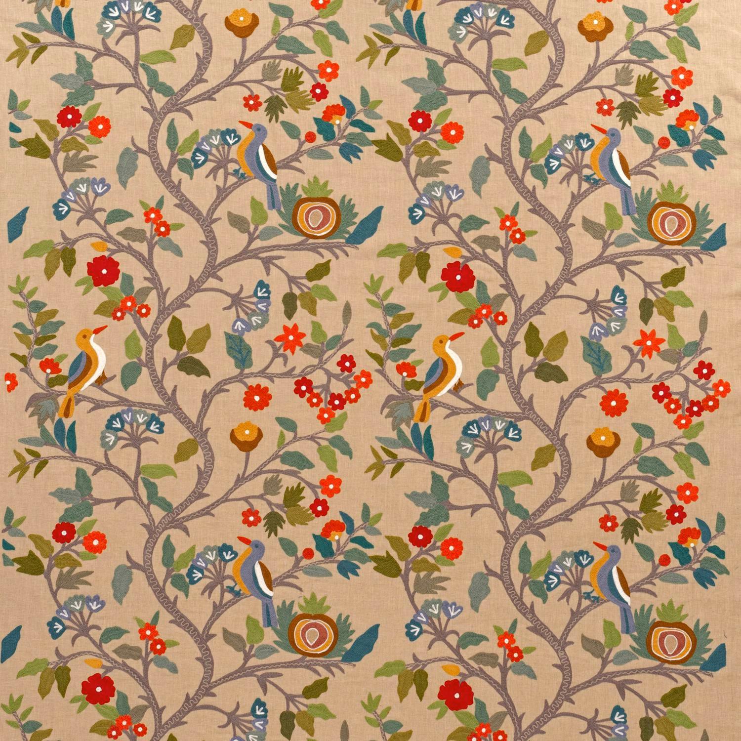 Warm beige embroidered fabric with teal birds, red flowers and branching grey-brown vines