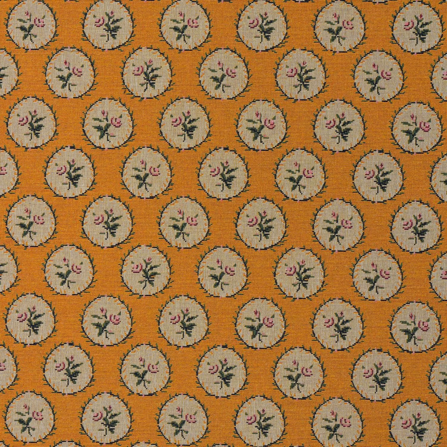 Ochre-orange woven ground with cream floral medallions and dusky pink sprigs