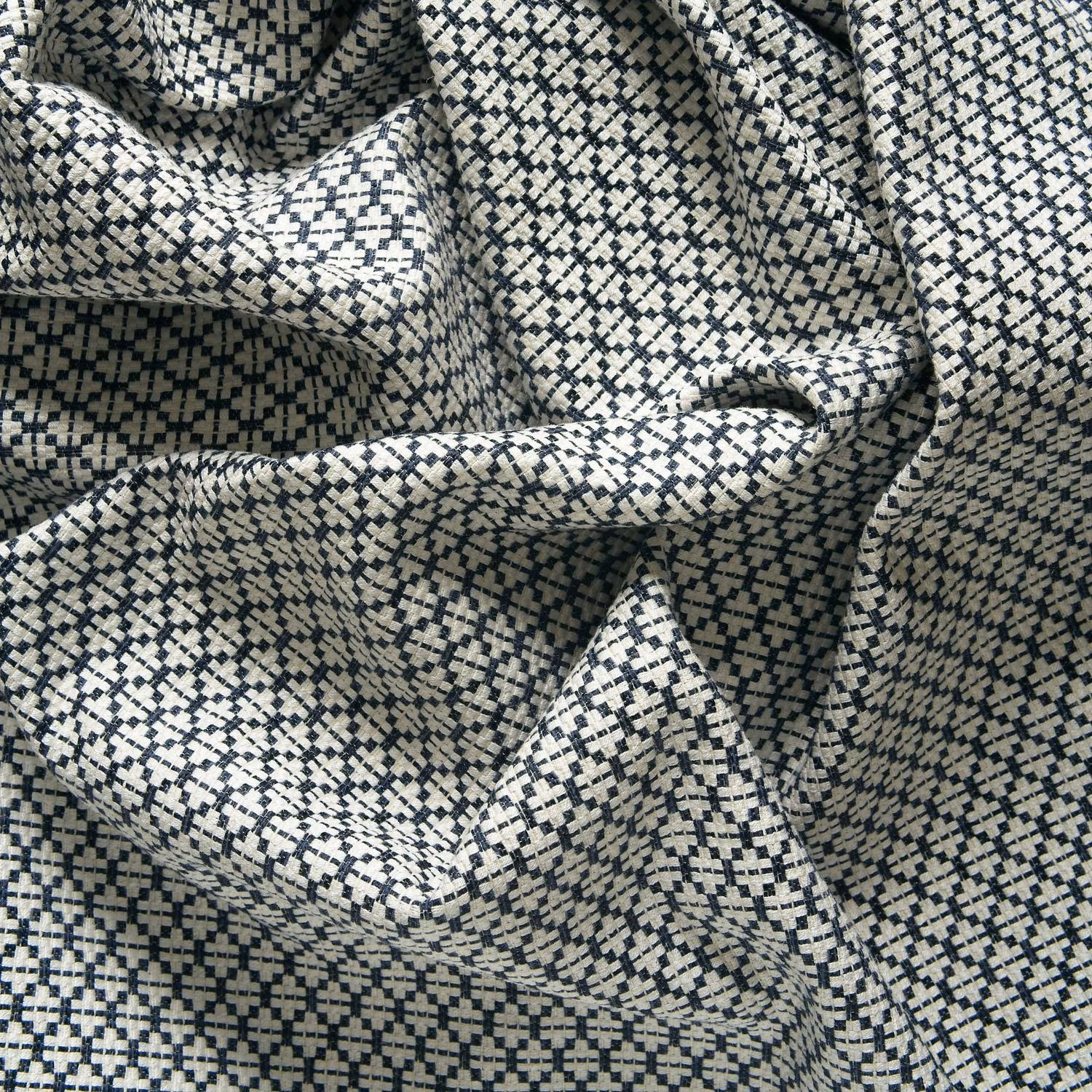 Navy and ivory pixel-check woven fabric gathered into sculptural folds