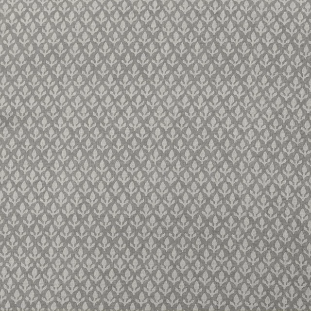 Cloud-grey woven ground with small pale botanical motifs in repeating rows